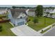 Gray two-story house with a gray roof and a two-car garage, nicely landscaped lawn at 575 Rosings Dr, Summerville, SC 29486