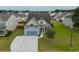 Two-story home with a two-car garage and well-manicured lawn at 575 Rosings Dr, Summerville, SC 29486