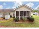 Screened porch and yard with well-maintained landscaping at 101 Dupont Way, Summerville, SC 29485