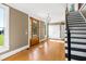 Spacious entryway with hardwood floors, a grand staircase, and an abundance of natural light at 7848 Pelican Bay Dr, Awendaw, SC 29429