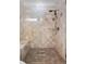 Walk-in shower with built-in seat and neutral tone tile at 7848 Pelican Bay Dr, Awendaw, SC 29429
