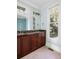 Elegant bathroom with a double vanity, marble countertops, and a large mirror at 7848 Pelican Bay Dr, Awendaw, SC 29429