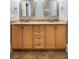 Bathroom with double vanity, light wood cabinets, and granite countertops at 7848 Pelican Bay Dr, Awendaw, SC 29429