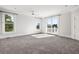 Bright bedroom with carpeting and access to a balcony at 7848 Pelican Bay Dr, Awendaw, SC 29429