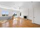 Bright bonus room with hardwood floors, fireplace, and access to balcony at 7848 Pelican Bay Dr, Awendaw, SC 29429