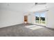 Spacious bedroom with carpet flooring, access to a private balcony, and ample natural light at 7848 Pelican Bay Dr, Awendaw, SC 29429