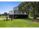 Home with garage and firepit in the backyard at 7848 Pelican Bay Dr, Awendaw, SC 29429
