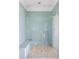 Large walk-in shower with glass enclosure and light blue mosaic tile at 7848 Pelican Bay Dr, Awendaw, SC 29429