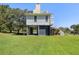 Two-story home with attached garage at 7848 Pelican Bay Dr, Awendaw, SC 29429