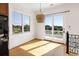 Bright breakfast area with hardwood floors and sliding glass doors to balcony at 7848 Pelican Bay Dr, Awendaw, SC 29429