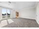 Spacious bedroom with balcony access and carpet flooring at 7848 Pelican Bay Dr, Awendaw, SC 29429
