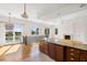 Open concept kitchen with island and breakfast area, hardwood floors at 7848 Pelican Bay Dr, Awendaw, SC 29429