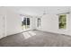 Bright bedroom with carpet flooring, access to a private balcony, and large windows at 7848 Pelican Bay Dr, Awendaw, SC 29429