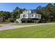 Two story home with large yard and driveway at 7848 Pelican Bay Dr, Awendaw, SC 29429