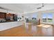 Open concept kitchen with island and hardwood floors at 7848 Pelican Bay Dr, Awendaw, SC 29429