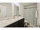 Bathroom with double sinks, dark vanity, and a shower/tub combo at 175 Rosefield Ct, Summerville, SC 29485