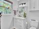 Bright bathroom with white vanity, marble countertop, and updated fixtures at 205 Whitesville Rd, Moncks Corner, SC 29461