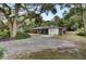 Ranch home with attached garage and large shade trees at 205 Whitesville Rd, Moncks Corner, SC 29461