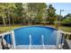 Inviting above-ground pool with a wooden deck at 205 Whitesville Rd, Moncks Corner, SC 29461