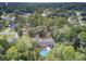 Aerial view showcasing a ranch style home with a circular pool in a wooded area at 205 Whitesville Rd, Moncks Corner, SC 29461
