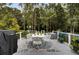 Spacious deck with seating area, grill, and wooded backdrop at 205 Whitesville Rd, Moncks Corner, SC 29461