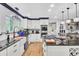Open concept kitchen with white cabinets, granite island, and stainless steel appliances at 205 Whitesville Rd, Moncks Corner, SC 29461