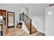 Basement stairs with modern metal railing and wood steps at 205 Whitesville Rd, Moncks Corner, SC 29461