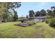 Large backyard with raised garden beds and above ground pool at 205 Whitesville Rd, Moncks Corner, SC 29461
