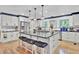Modern kitchen with white cabinets, granite island, and stainless steel appliances at 205 Whitesville Rd, Moncks Corner, SC 29461