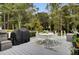 Spacious deck with seating area, grill, and wooded backdrop at 205 Whitesville Rd, Moncks Corner, SC 29461