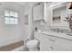 Clean bathroom, featuring white cabinets, a marble countertop, and a tub at 205 Whitesville Rd, Moncks Corner, SC 29461