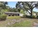 Brick ranch home nestled amongst lush greenery at 205 Whitesville Rd, Moncks Corner, SC 29461