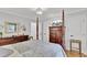 Main bedroom with wooden four-poster bed, dresser, and hardwood floors at 205 Whitesville Rd, Moncks Corner, SC 29461