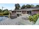Spacious deck with pool, patio furniture, and lush landscaping at 205 Whitesville Rd, Moncks Corner, SC 29461