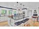 Updated kitchen boasts white cabinets, granite counters, and stainless steel appliances at 205 Whitesville Rd, Moncks Corner, SC 29461