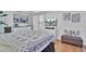 Main bedroom with white furniture, TV, and hardwood floors at 205 Whitesville Rd, Moncks Corner, SC 29461