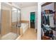 Large bathroom with a walk-in shower, bathtub, and closet at 208 Sweetspire Ln, Summerville, SC 29483