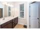 Bathroom features a double vanity and a large window at 208 Sweetspire Ln, Summerville, SC 29483