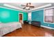 Relaxing bedroom with hardwood floors, ceiling fan and access to bathroom at 208 Sweetspire Ln, Summerville, SC 29483