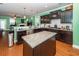Open concept kitchen boasts granite countertops, stainless steel appliances, and breakfast bar at 208 Sweetspire Ln, Summerville, SC 29483