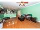 Open living room with hardwood floors, kitchen bar, and comfortable seating at 208 Sweetspire Ln, Summerville, SC 29483