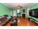 Spacious living room featuring hardwood floors, fireplace, and ample natural light at 208 Sweetspire Ln, Summerville, SC 29483