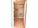 Laundry room with light brown laminate flooring and wire shelving at 106 Hardee Ave, Summerville, SC 29485