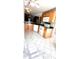 Bright kitchen with wood cabinets, granite countertops, and tile floors at 106 Hardee Ave, Summerville, SC 29485