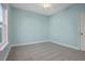 Light blue bedroom with gray carpet and a large window at 1174 Ayers Plantation Way, Mount Pleasant, SC 29466