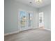 Bedroom with gray carpet and French doors leading to balcony at 1174 Ayers Plantation Way, Mount Pleasant, SC 29466