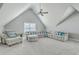 Relaxing bonus room featuring a sectional sofa and a large window at 620 Chigwell Springs Ln, Summerville, SC 29486