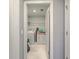 Convenient laundry room with washer, dryer, and ample shelving at 620 Chigwell Springs Ln, Summerville, SC 29486
