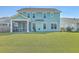 Two-story house with a screened porch and grassy backyard at 620 Chigwell Springs Ln, Summerville, SC 29486