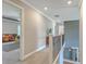 Upstairs hallway with neutral decor, carpeting, and access to bedrooms at 620 Chigwell Springs Ln, Summerville, SC 29486